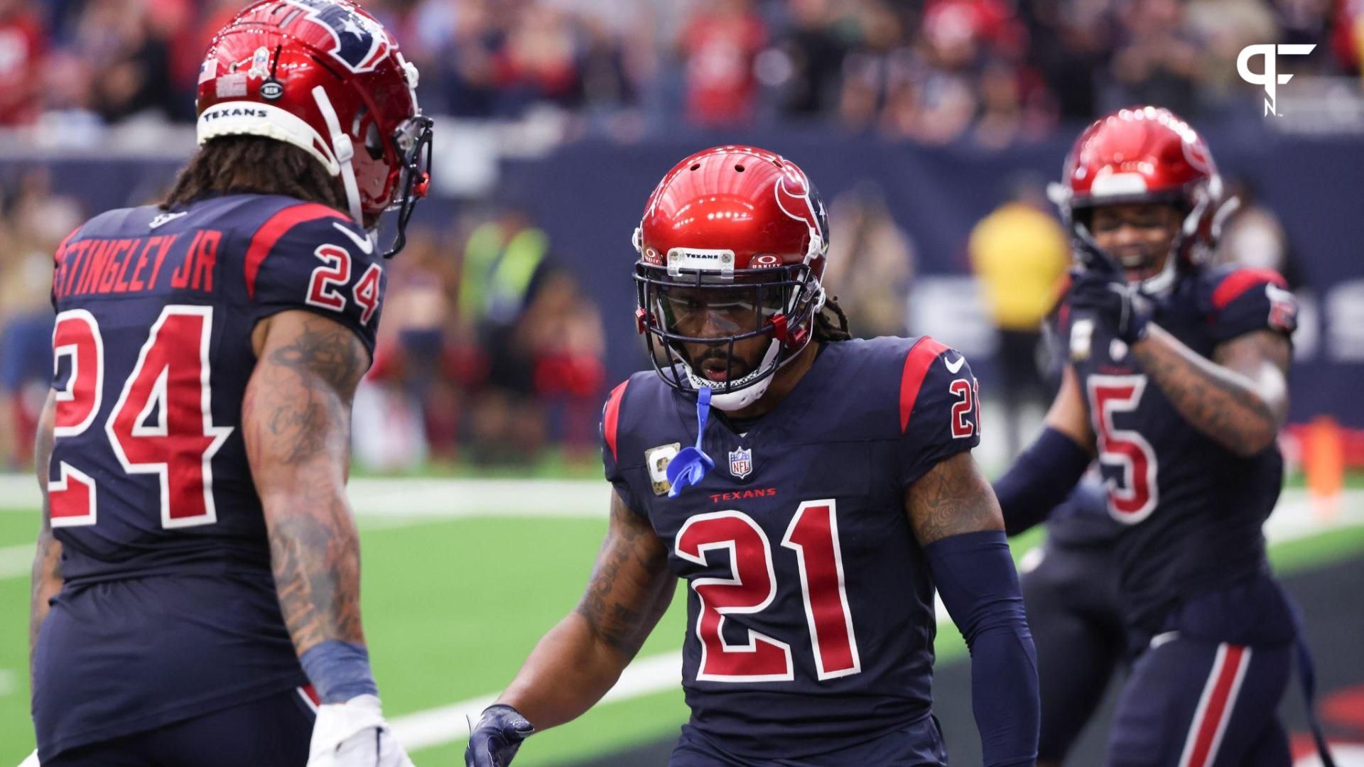 Houston Texans cornerback Derek Stingley Jr. (24) celebrates cornerback Steven Nelson (21) defensive play against the Arizona Cardinals in the second half at NRG Stadium.