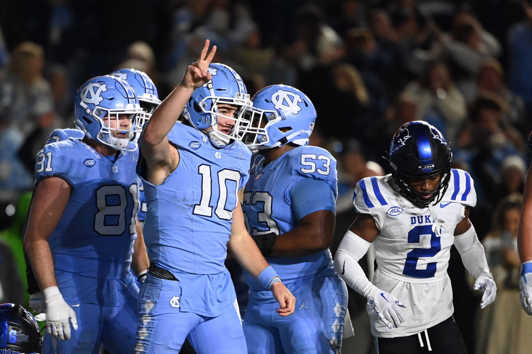 North Carolina Tar Heels quarterback Drake Maye (10) signals the Tar Heels will be going for a two point conversion after scoring a touchdown in the second overtime at Kenan Memorial Stadium.