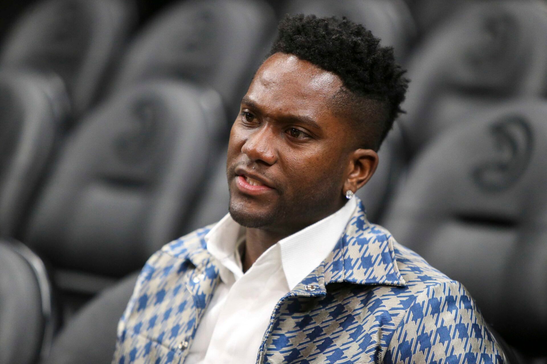 Former Atlanta Falcons wide receiver Harry Douglas on the sideline before a game between the Philadelphia 76ers and Atlanta Hawks at State Farm Arena.