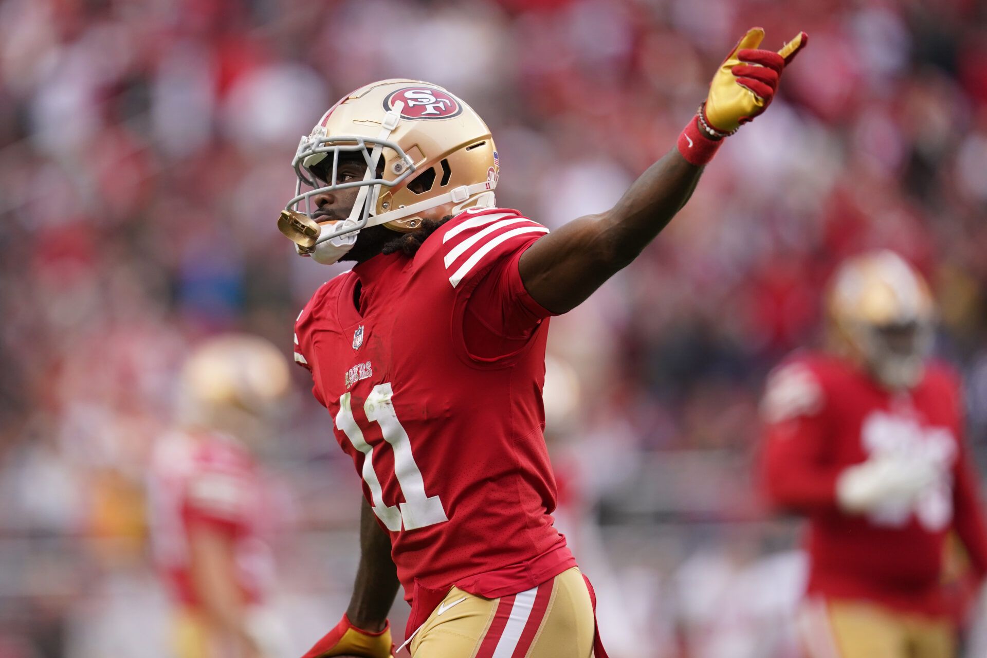 San Francisco 49ers wide receiver Brandon Aiyuk (11) celebrates after catching a touchdown pass against the Tampa Bay Buccaneers in the second quarter at Levi's Stadium.