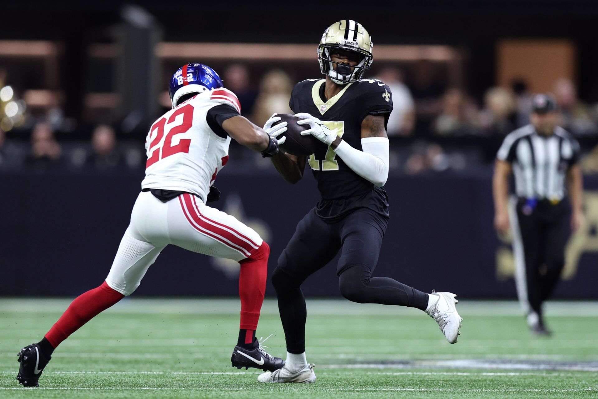 New Orleans Saints wide receiver A.T. Perry (17) makes a catch ahead of New York Giants cornerback Adoree' Jackson (22) during the second half at Caesars Superdome.