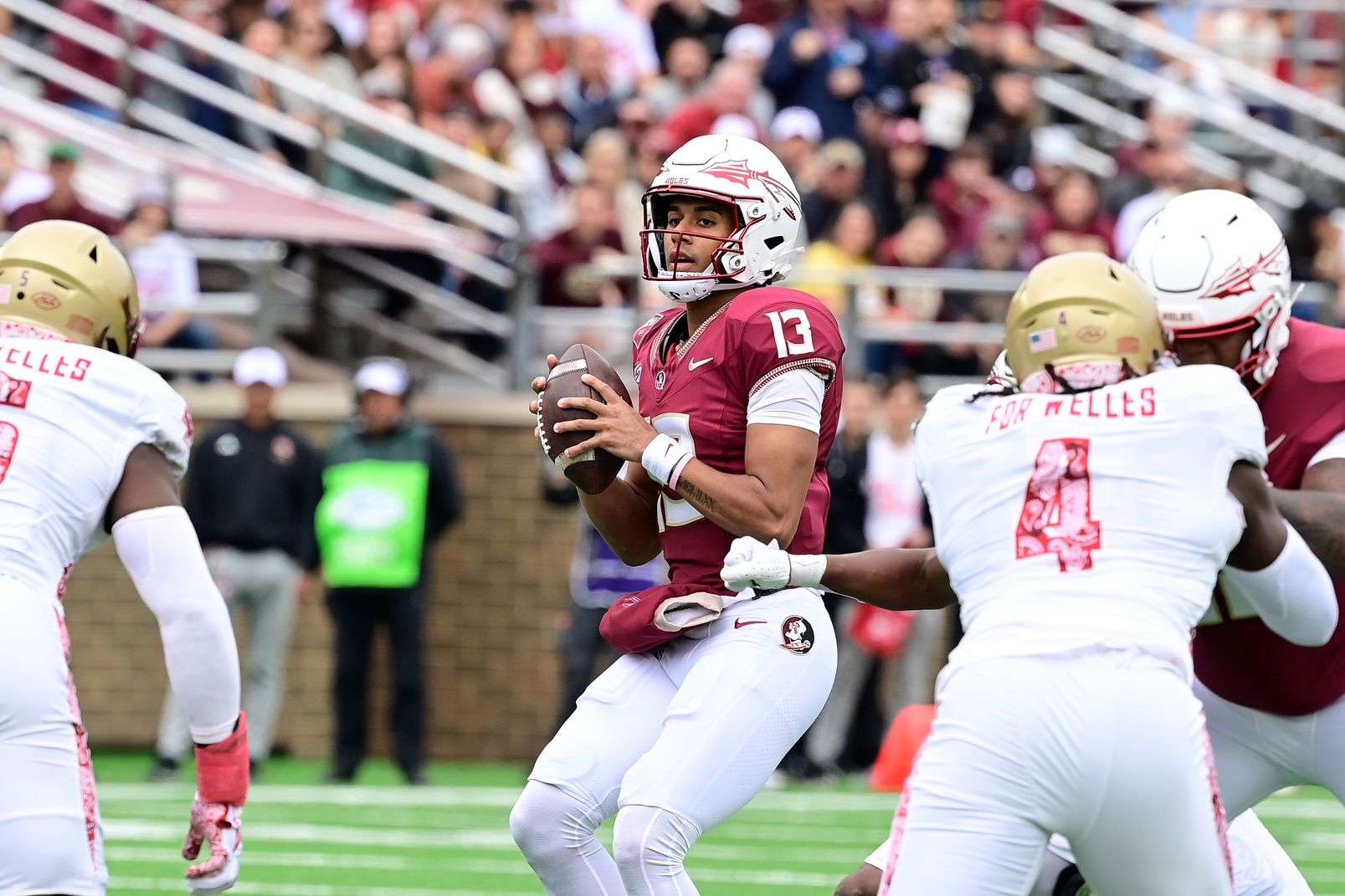 Florida State Seminoles quarterback Jordan Travis (13) looks to pass during the first half against the Boston College Eagles at Alumni Stadium.