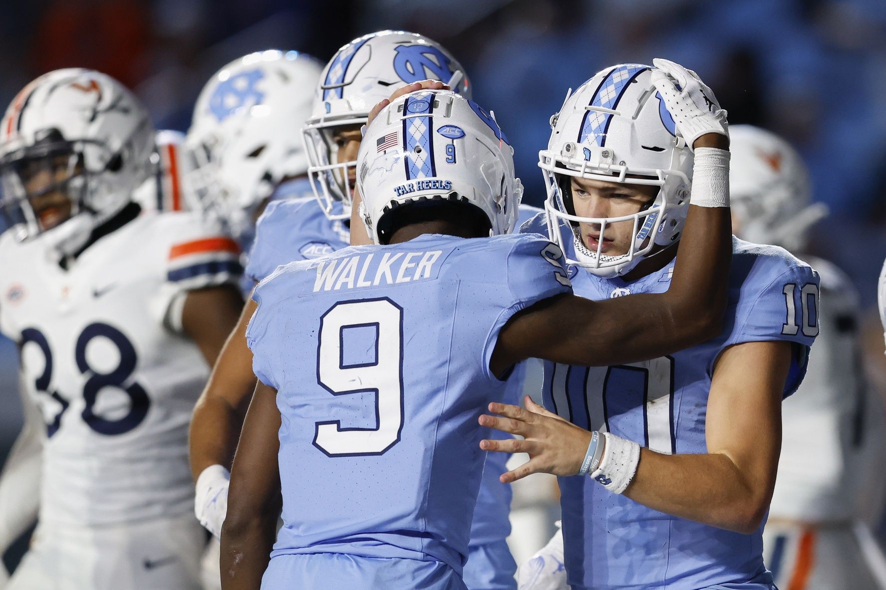 North Carolina Tar Heels QB Drake Maye (10) celebrates with WR Devontez Walker (9) after scoring a touchdown.