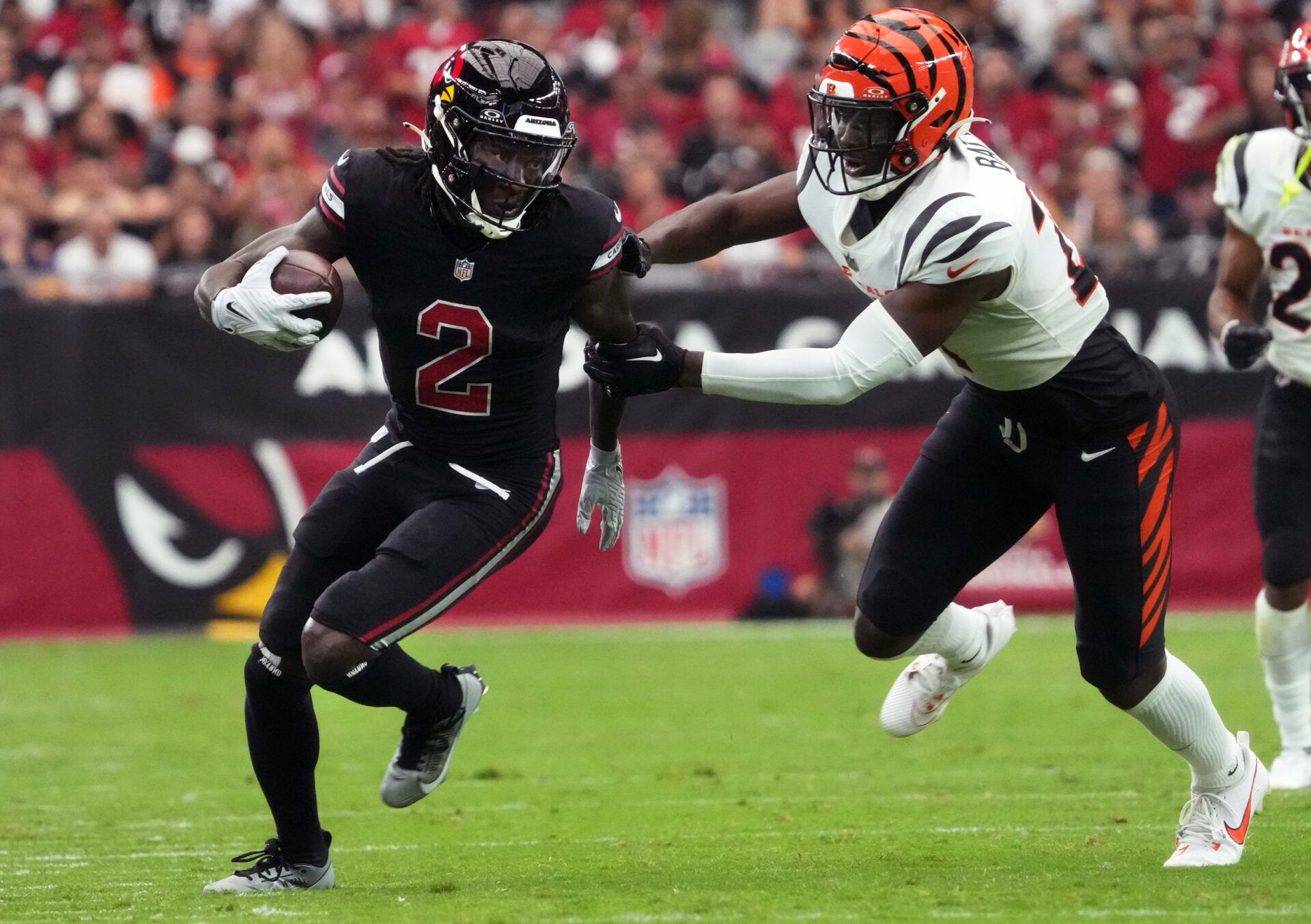 Oct 8, 2023; Glendale, Arizona, USA; Arizona Cardinals receiver Marquise Brown (2) runs against Cincinnati Bengals safety Jordan Battle (27) at State Farm Stadium. Mandatory Credit: Joe Rondone-USA TODAY Sports