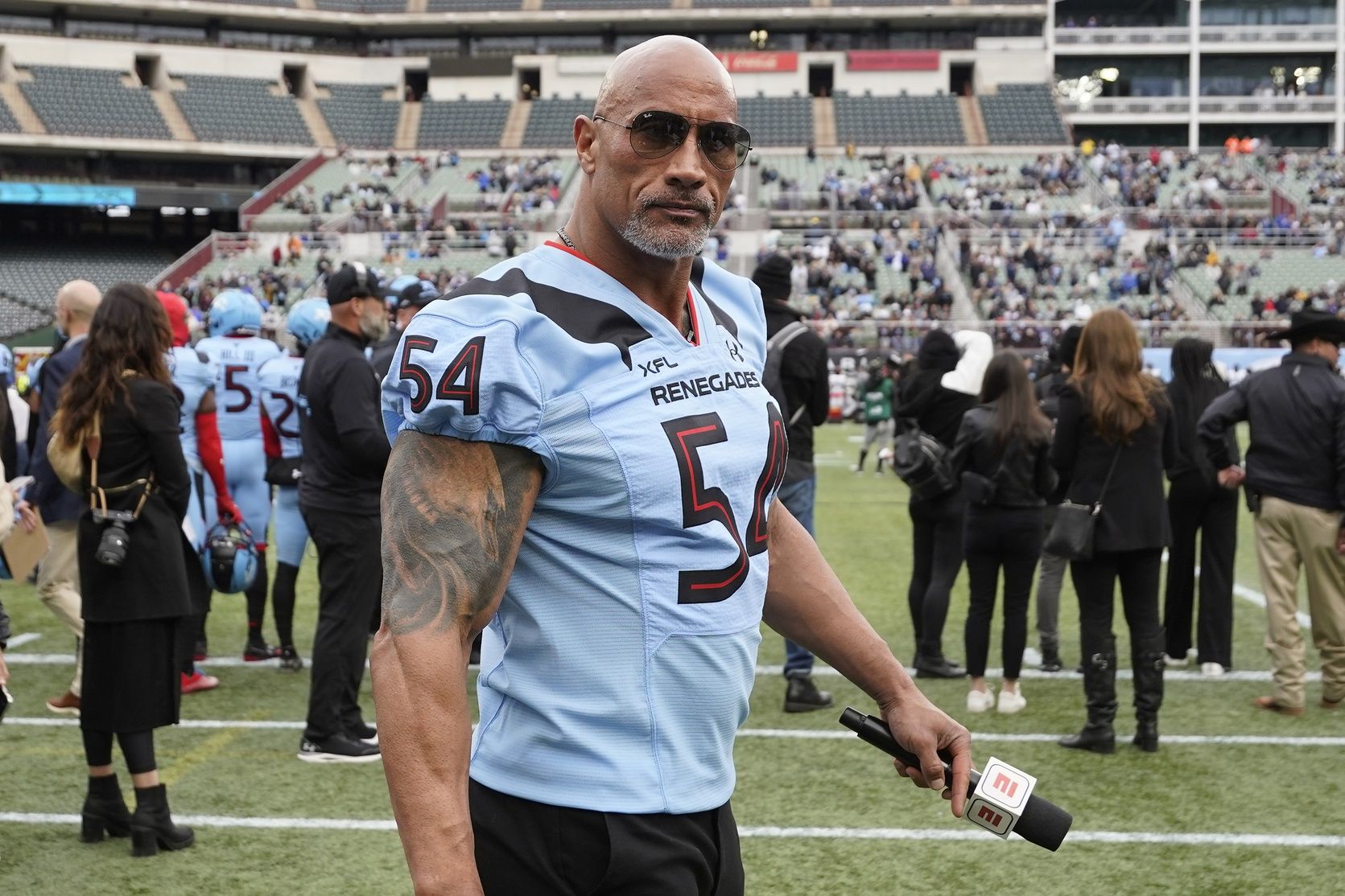 XFL owner Dwayne Johnson on the sidelines during the first half between the Vegas Vipers and the Arlington Renegades at Choctaw Stadium.