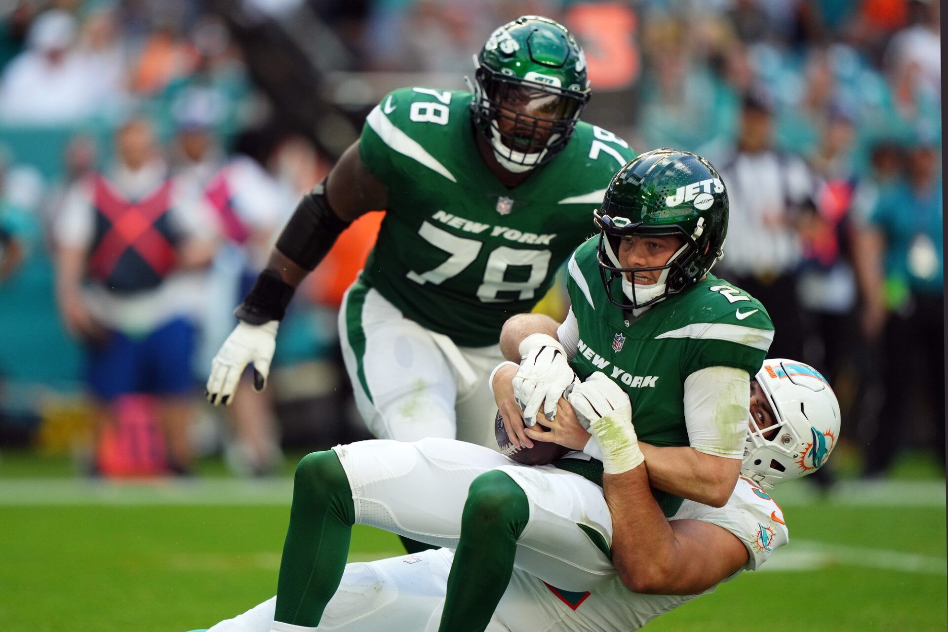 Miami Dolphins defensive tackle Zach Sieler (92) sacks New York Jets quarterback Zach Wilson (2) during the first half at Hard Rock Stadium.