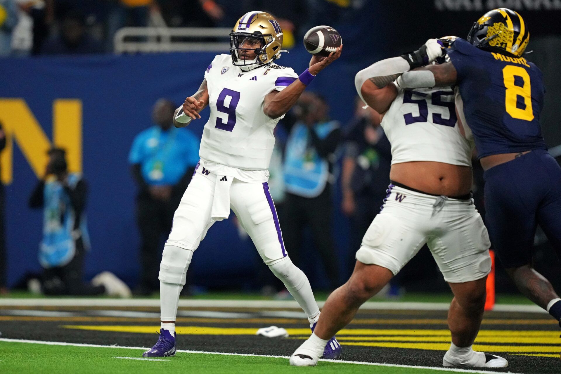 Washington Huskies QB Michael Penix Jr. (9) throws a pass against the Michigan Wolverines.