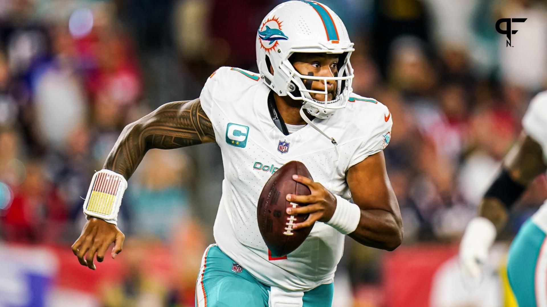 Miami Dolphins quarterback Tua Tagovailoa (1) looks to pass against the New England Patriots in the first half at Gillette Stadium.