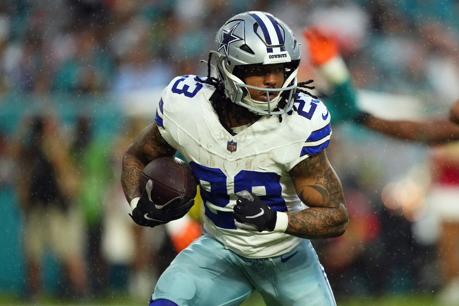 Dallas Cowboys running back Rico Dowdle (23) rushes with the ball during the first half against the Miami Dolphins at Hard Rock Stadium.