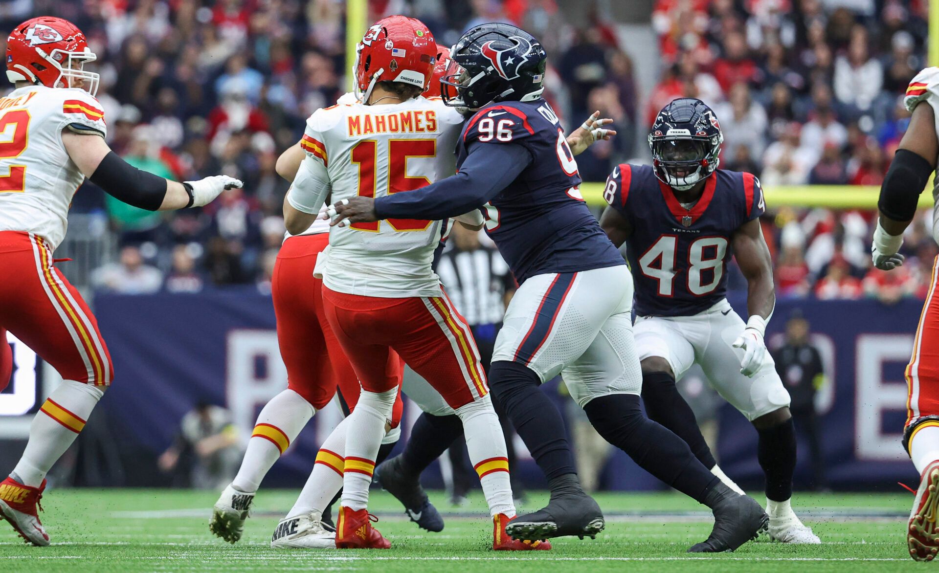 Houston Texans defensive tackle Maliek Collins (96) tackles Kansas City Chiefs quarterback Patrick Mahomes (15) on a play during the second quarter at NRG Stadium.