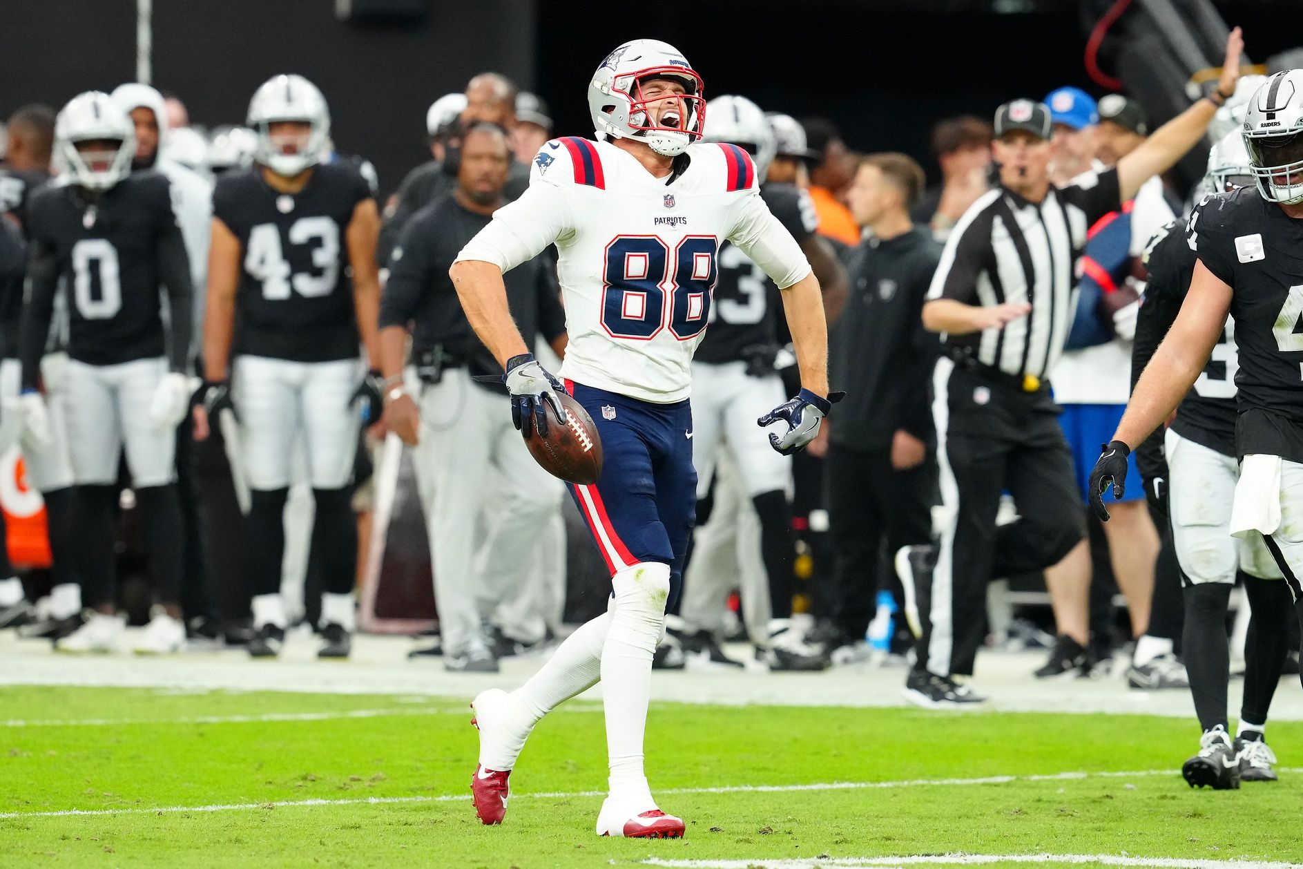 New England Patriots tight end Mike Gesicki (88) celebrates after making a play against the Las Vegas Raiders during the second quarter at Allegiant Stadium.