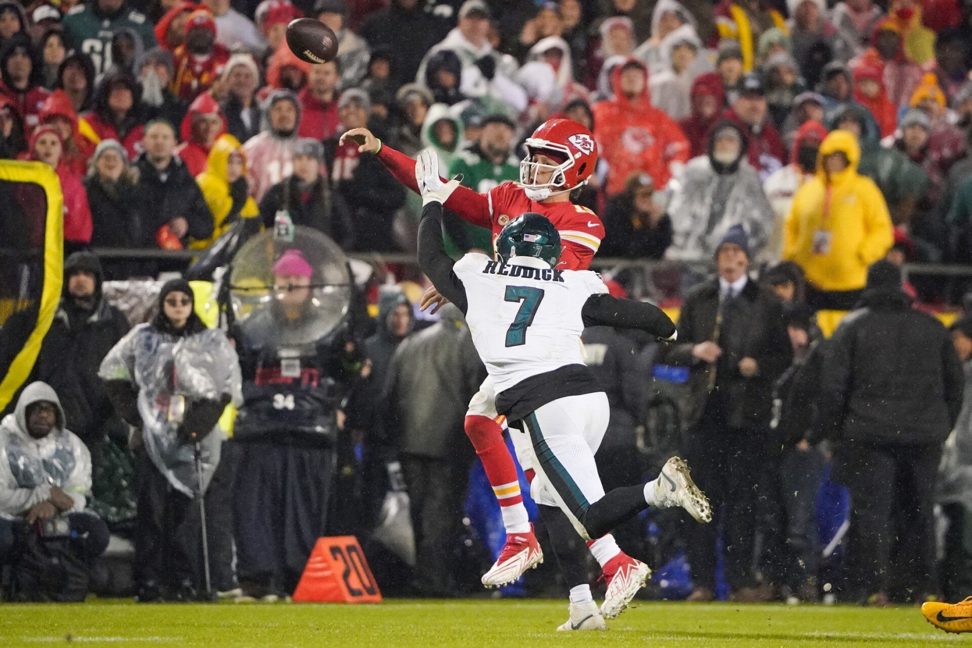 Kansas City Chiefs quarterback Patrick Mahomes (15) throws a pass as Philadelphia Eagles linebacker Haason Reddick (7) defends during the second half at GEHA Field at Arrowhead Stadium.