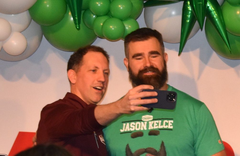 Mick Beekhuizen, president of Campbell Soup Co.'s Meals & Beverages unit, takes a selfie with Jason Kelce. During a ceremony, Beekhuizen presented Kelce with a ceremonial check for a $62,000 donation ...