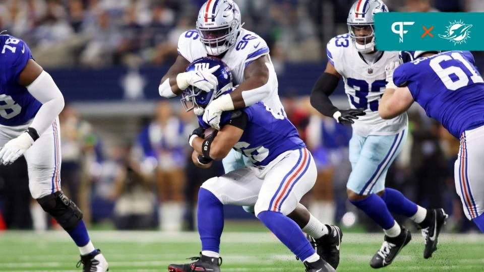 Dallas Cowboys DT Neville Gallimore (96) tackles New York Giants RB Saquon Barkley (26).