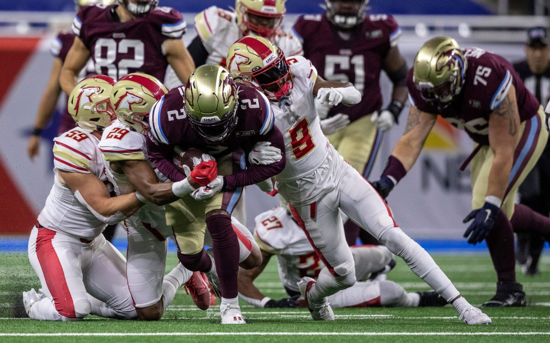 Michigan Panthers' Stevie Scott ll (2) is tackled by three defenders during a game against the Birmingham Stallions at Ford Field in Detroit on Saturday, May 20, 2023.