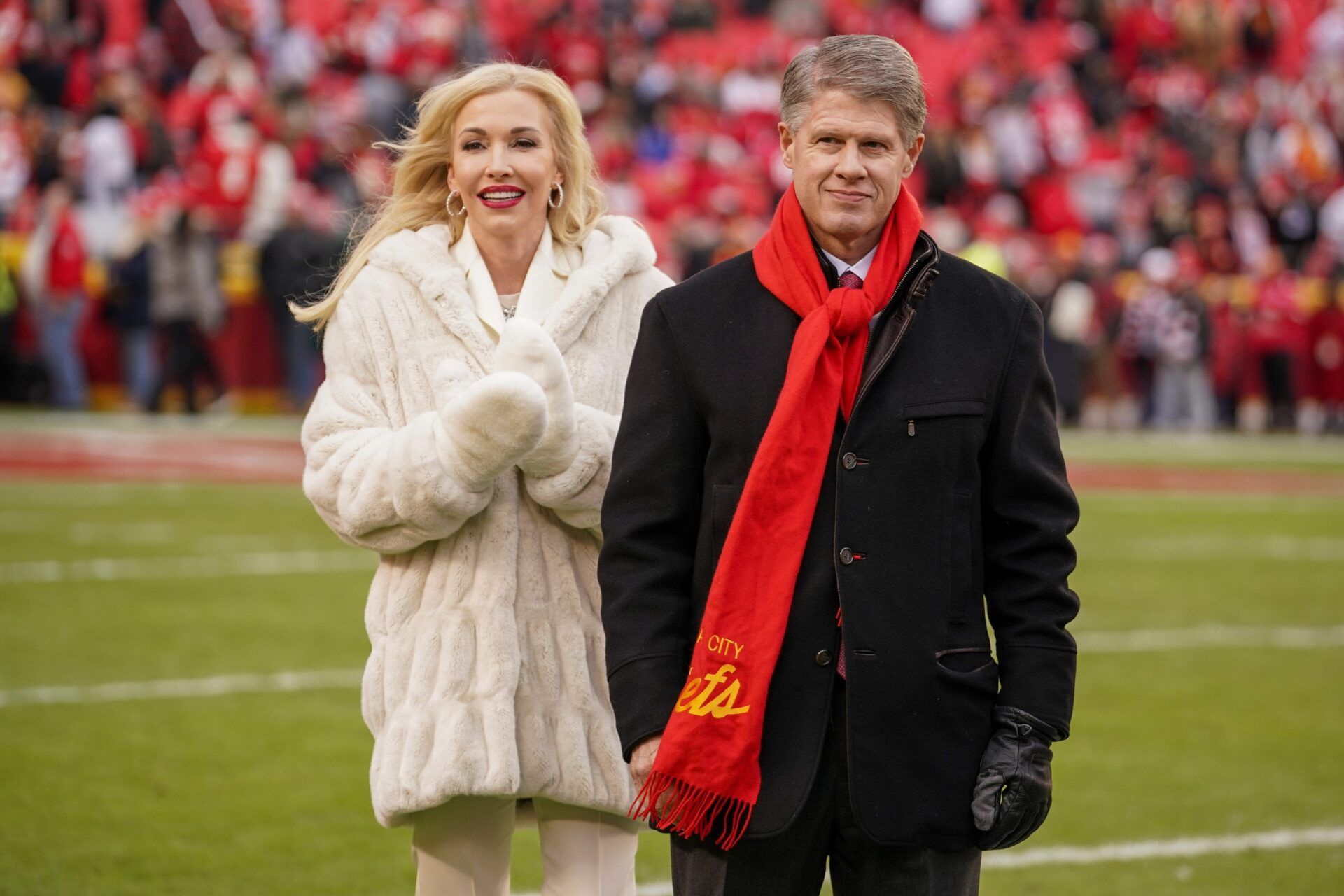 Kansas City Chiefs chief executive officer Clark Hunt and wife Tavia Shackles on field against the Cincinnati Bengals prior to a game at GEHA Field at Arrowhead Stadium.