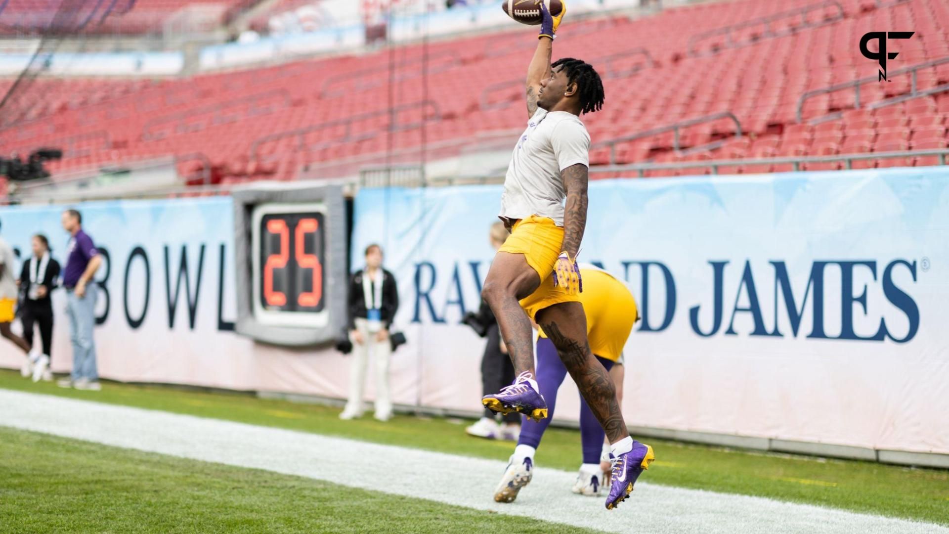 LSU Tigers wide receiver Malik Nabers (8) makes a catch before the game against the Wisconsin Badgers at Raymond James Stadium.