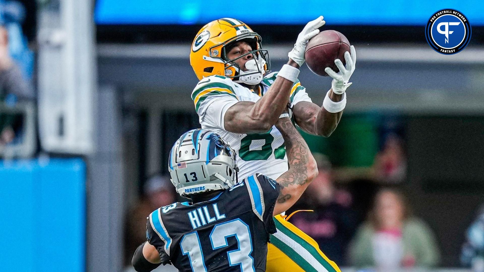 Green Bay Packers wide receiver Romeo Doubs (87) against Carolina Panthers cornerback Troy Hill (13) during the second half at Bank of America Stadium.