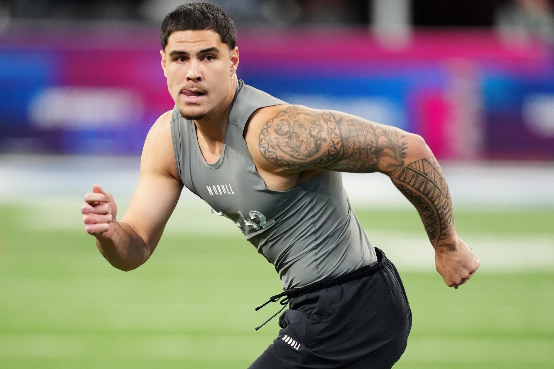 UCLA defensive lineman Laiatu Latu (DL42) works out during the 2024 NFL Combine at Lucas Oil Stadium.