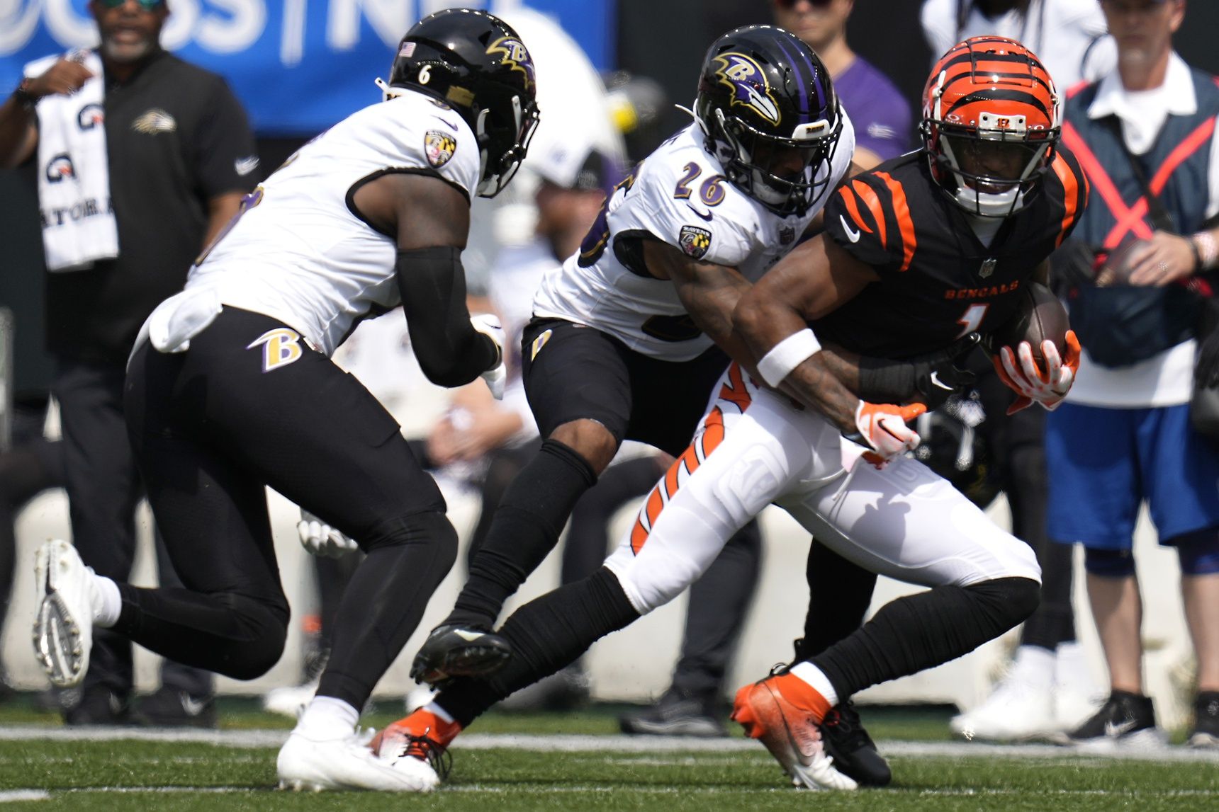 Cincinnati Bengals wide receiver Ja'Marr Chase (1) complete a catch as Baltimore Ravens safety Geno Stone (26) defends in the first quarter at Paycor Stadium.