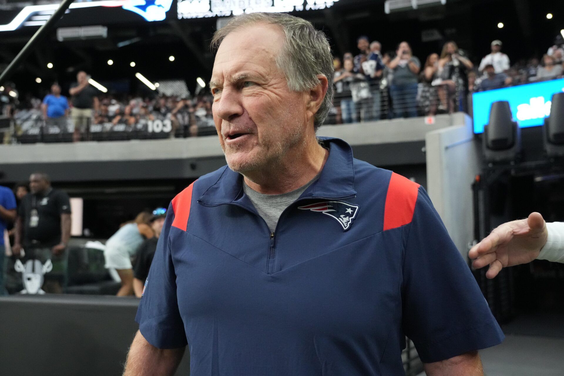 New England Patriots head coach Bill Belichick enters the field before the game against the Las Vegas Raiders at Allegiant Stadium.