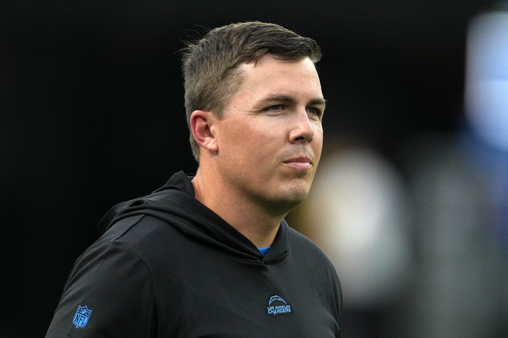 Los Angeles Chargers offensive coordinator Kellen Moore watches during the game against the Los Angeles Rams at SoFi Stadium.