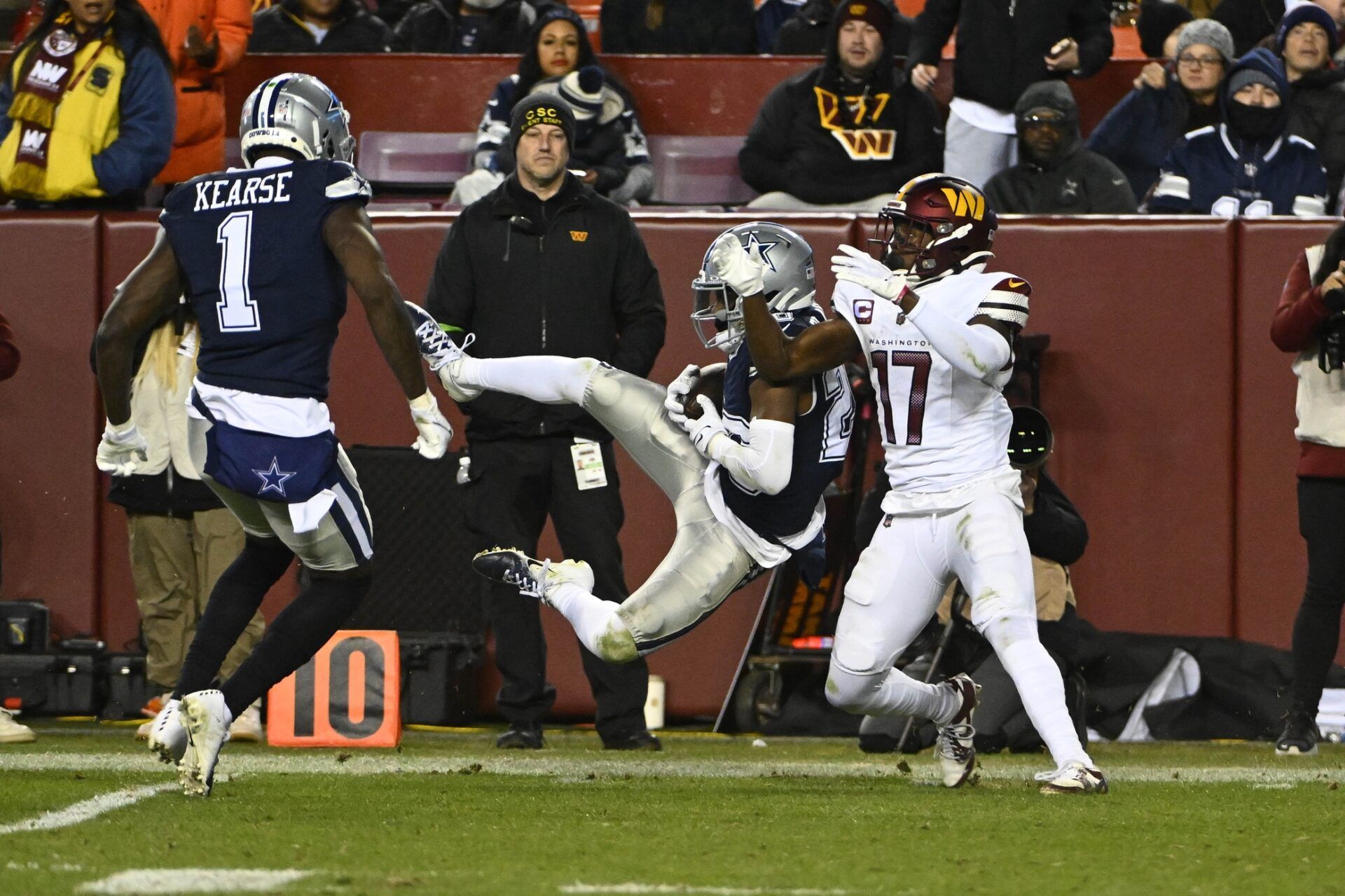 Dallas Cowboys cornerback DaRon Bland (26) intercepts a pass intended for Washington Commanders wide receiver Terry McLaurin (17) during the second half at FedExField.