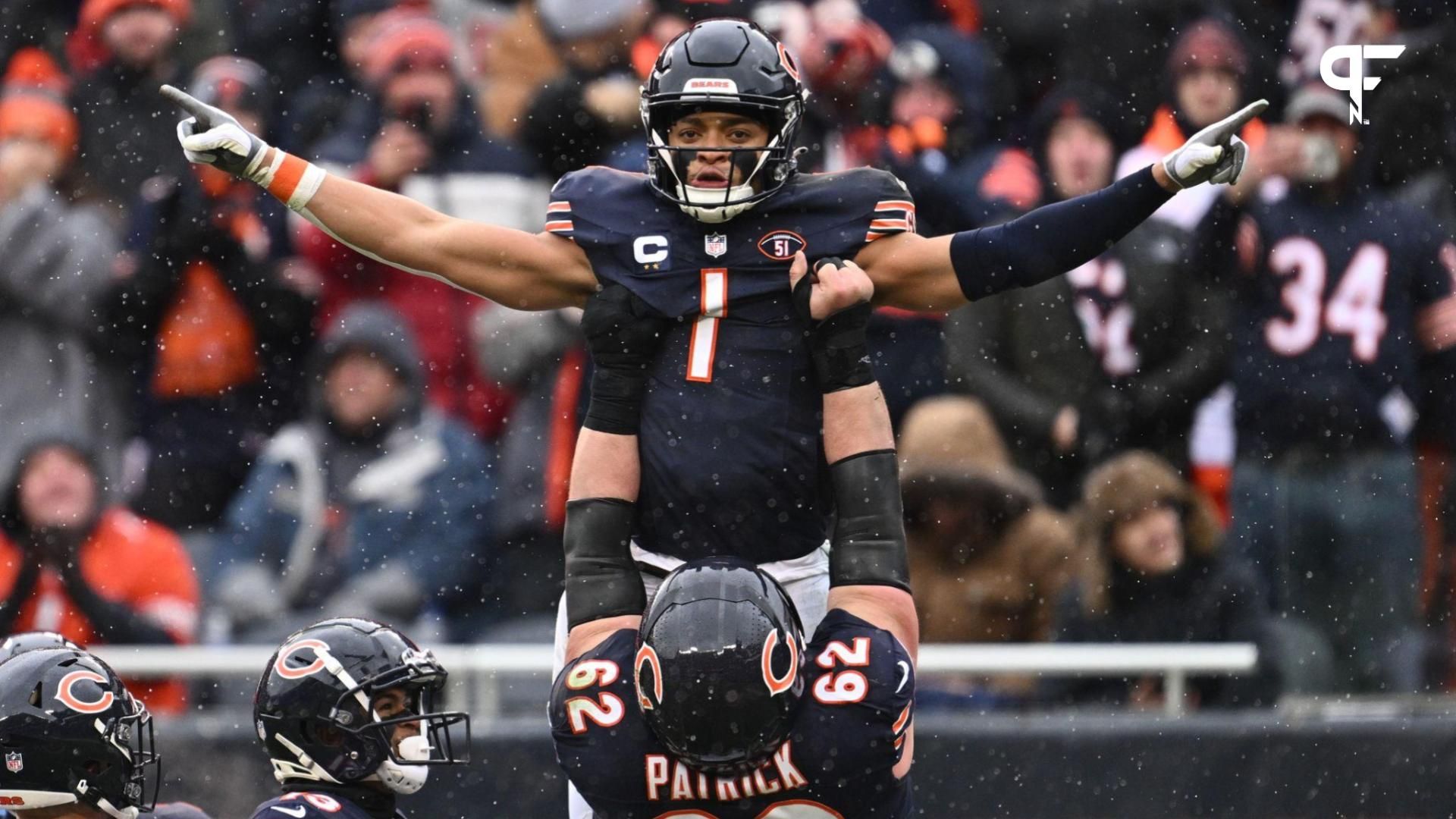 Chicago Bears quarterback Justin Fields (1) celebrates with offensive lineman Lucas Patrick (62) after running for a 9-yard touchdown in the first half against the Atlanta Falcons at Soldier Field.