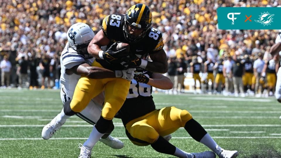 Iowa Hawkeyes TE Erick All (83) scores a touchdown against Utah State.