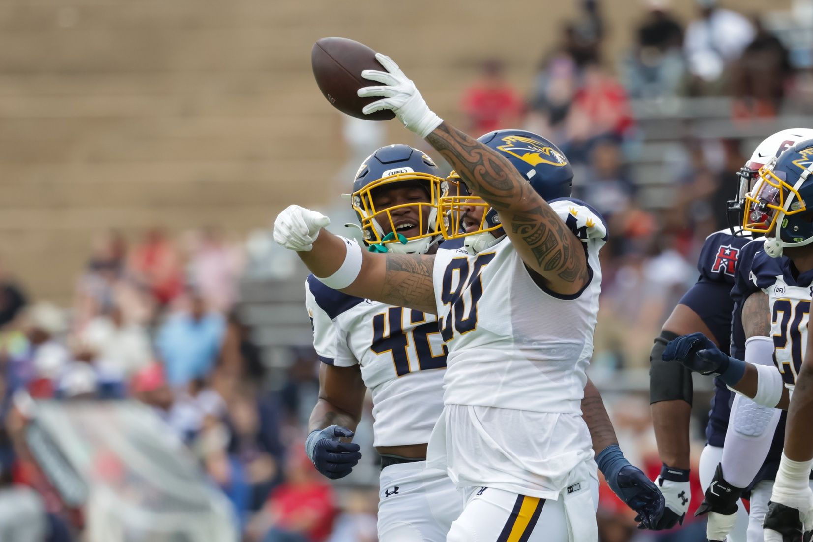 Memphis Showboats DL Dillon Faamatau (90) celebrates after recovering a Houston Roughnecks fumble.