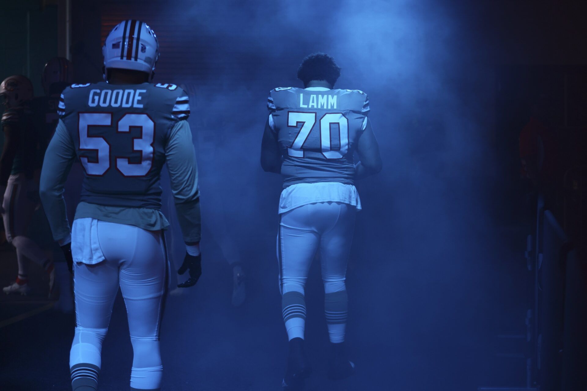 Miami Dolphins offensive tackle Kendall Lamm (70) and linebacker Cameron Goode (53) walk toward the field prior to the game against the Dallas Cowboys at Hard Rock Stadium.