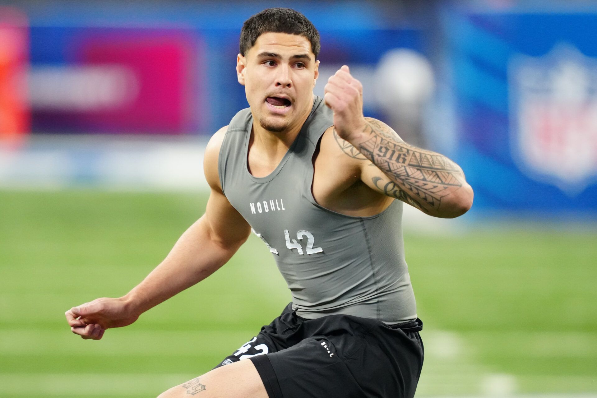 UCLA defensive lineman Laiatu Latu (DL42) works out during the 2024 NFL Combine at Lucas Oil Stadium.