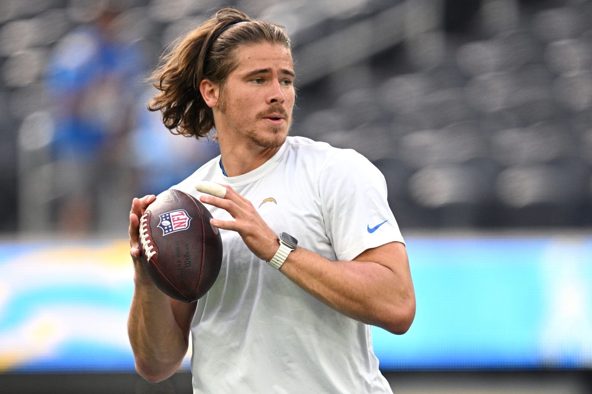 Los Angeles Chargers quarterback Justin Herbert (10) warms up before the game against the Detroit Lions at SoFi Stadium.