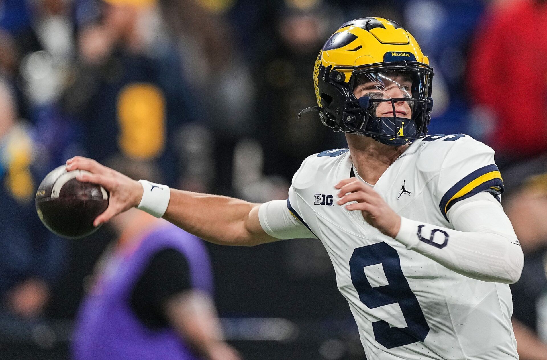 Michigan Wolverines quarterback J.J. McCarthy (9) warms-up on the field Saturday, Dec. 2, 2023, during the game at Lucas Oil Stadium in Indianapolis.