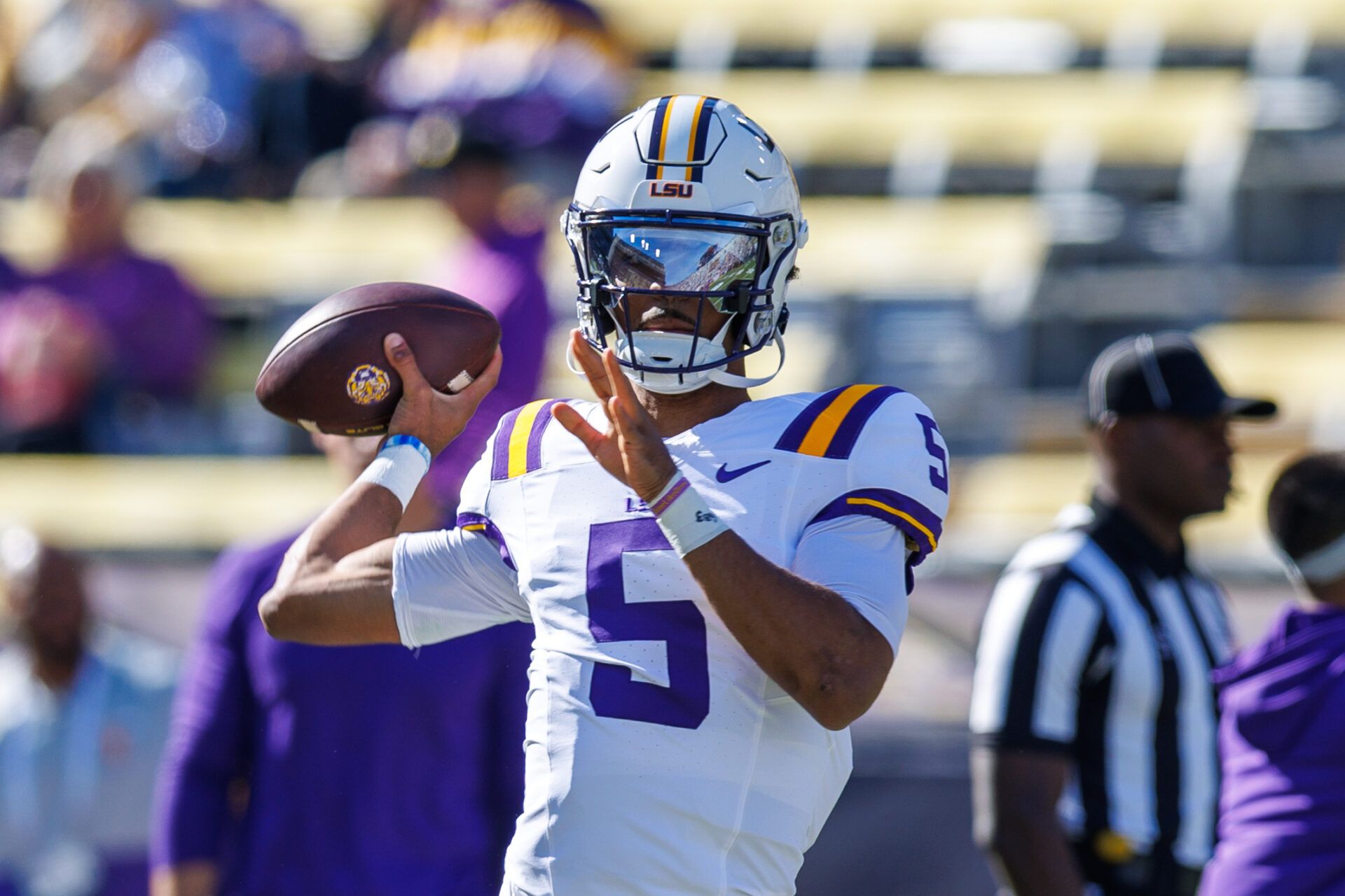 LSU Tigers quarterback Jayden Daniels (5) during warmups before the game against the Texas A&M Aggies at Tiger Stadium.