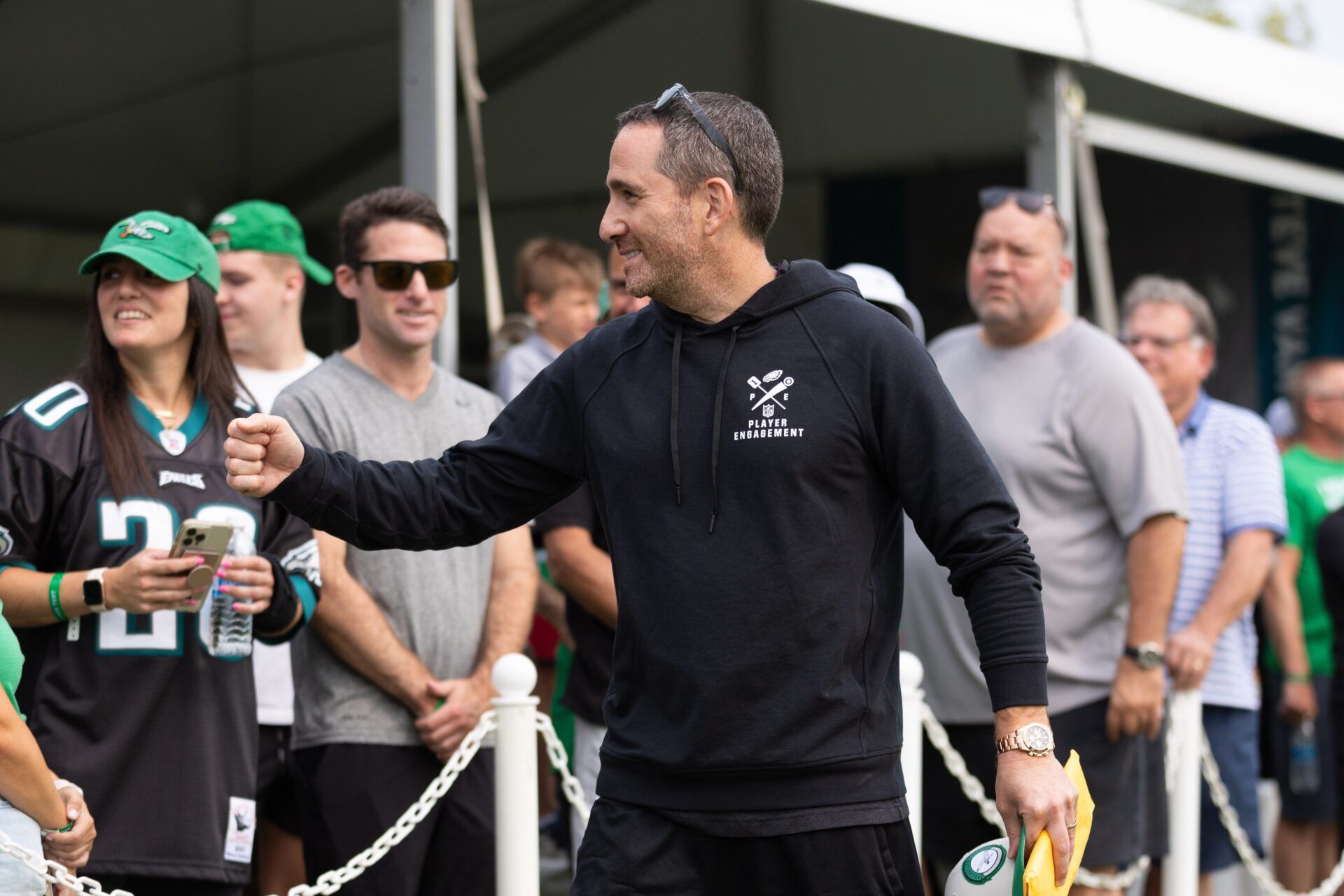 Philadelphia Eagles general manager Howie Roseman greets fans during practice at Novacare Complex.