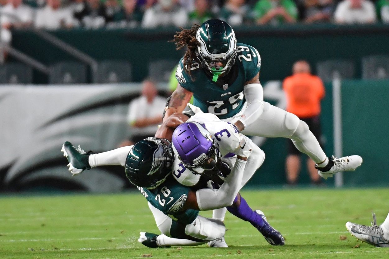 Minnesota Vikings wide receiver Jordan Addison (3) is tackled by Philadelphia Eagles cornerback Josh Jobe (28) and cornerback Avonte Maddox (29) at Lincoln Financial Field.