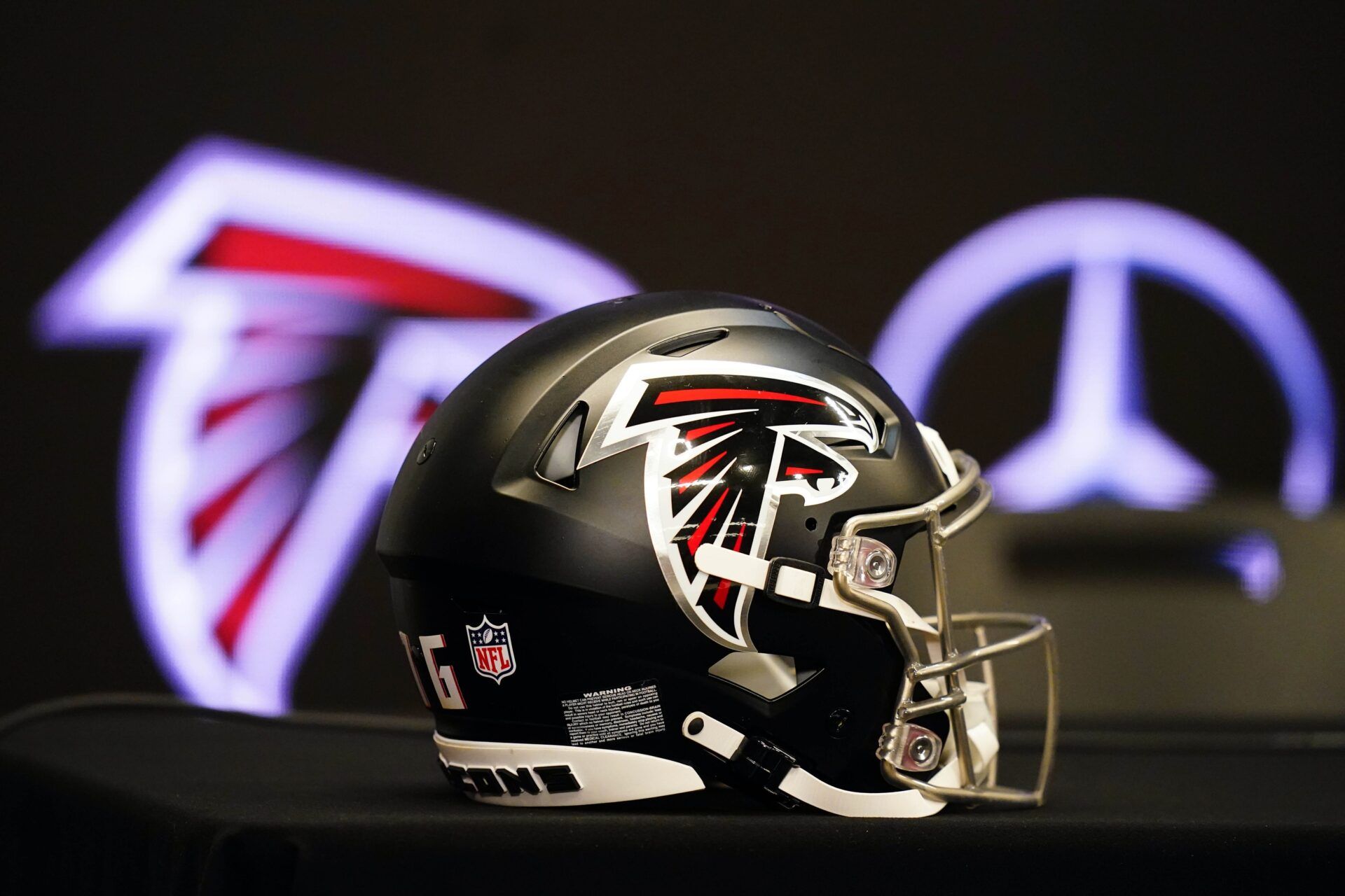 Atlanta Falcons helmet on the table before Raheem Morris is introduced as the new head coach of the Atlanta Falcons at Mercedes-Benz Stadium.