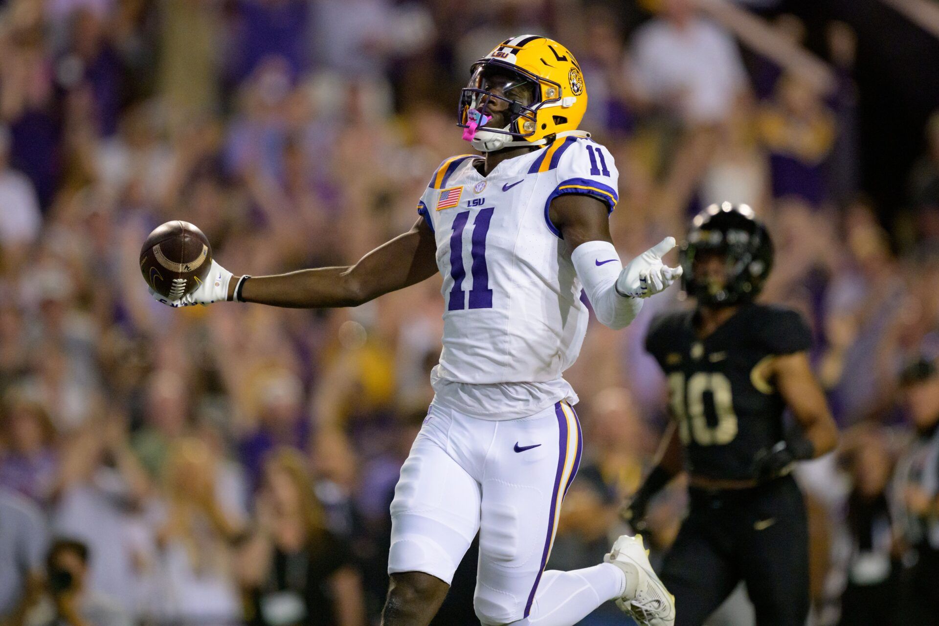 LSU Tigers WR Brian Thomas Jr. (11) celebrates after scoring a touchdown against the Army Black Knights.