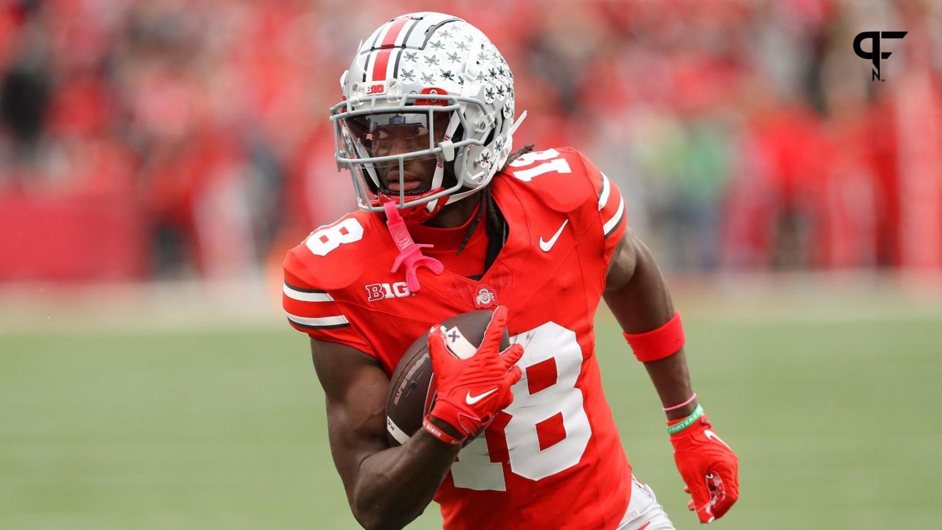 Ohio State Buckeyes wide receiver Marvin Harrison Jr. (18) scores a touchdown against the Penn State Nittany Lions during the fourth quarter at Ohio Stadium.