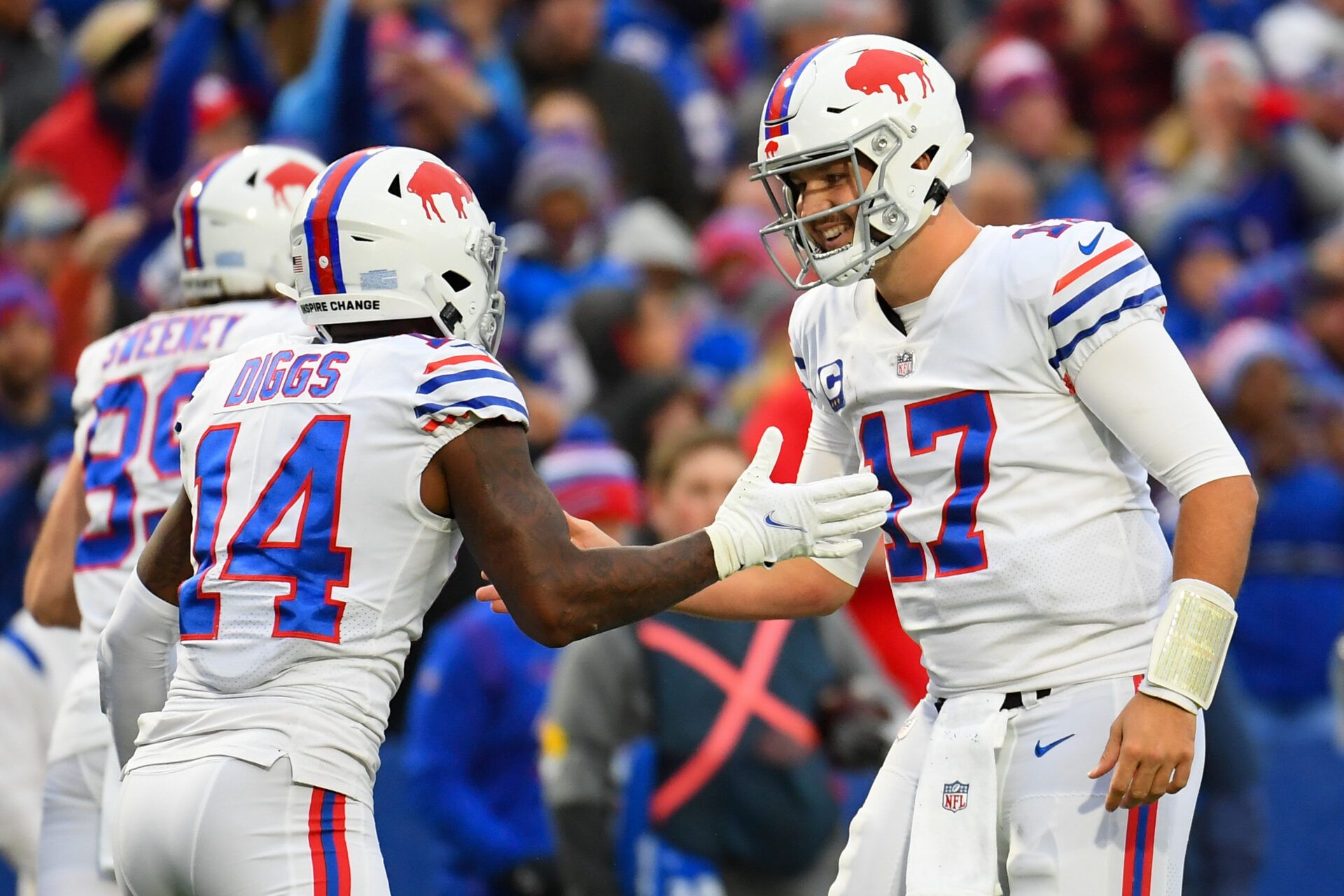 Buffalo Bills wide receiver Stefon Diggs (14) celebrates his touchdown catch with quarterback Josh Allen (17) against the Miami Dolphins during the second half at Highmark Stadium.