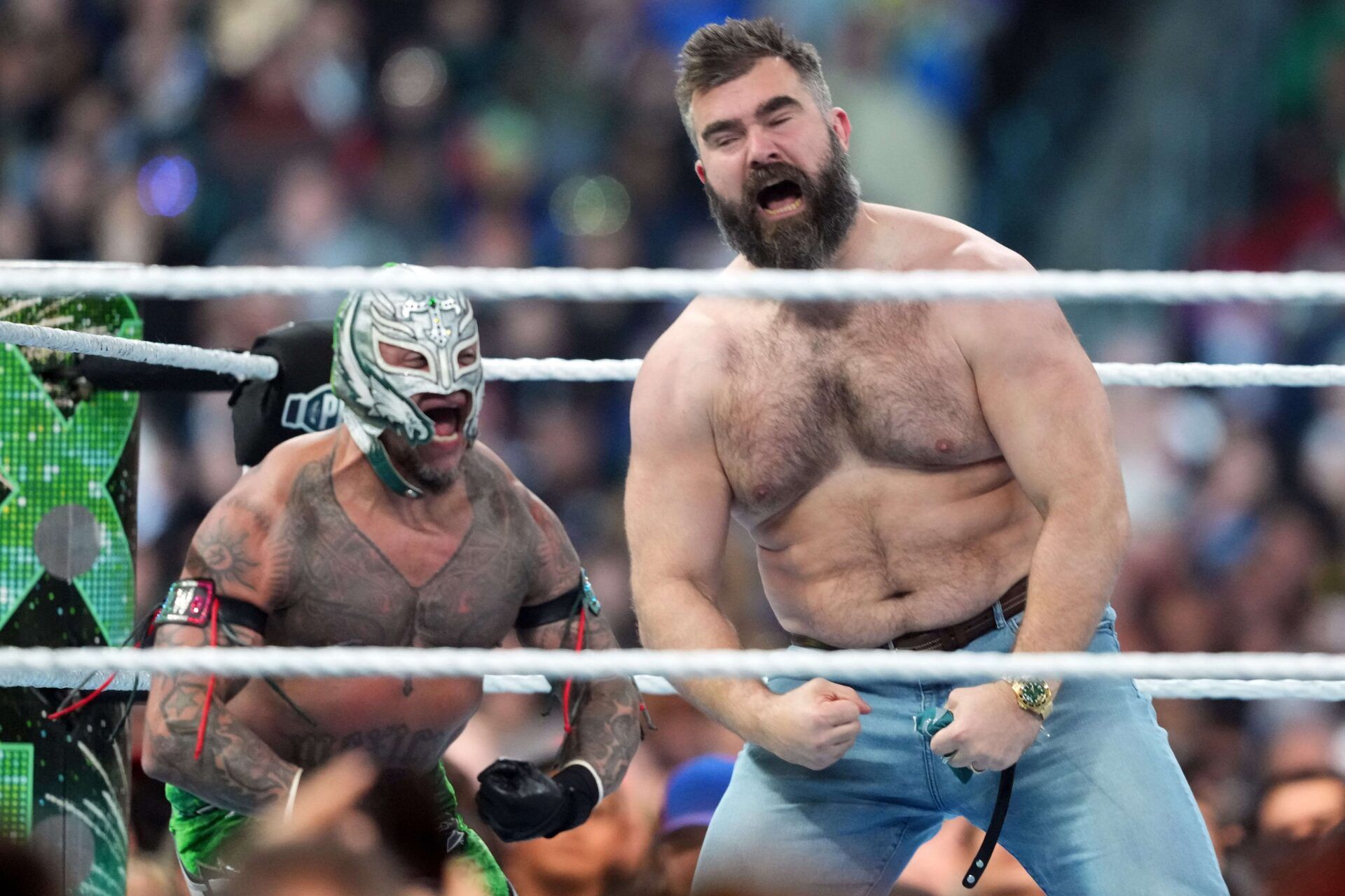 Jason Kelce (right) appears during Rey Mysterio & Dragon Lee vs. Dominik Mysterio & Santos Escobar during Wrestlemania XL Saturday at Lincoln Financial Field.