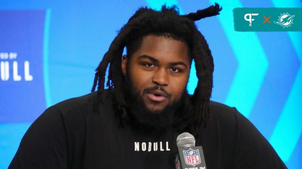 Illinois defensive lineman Johnny Newton (DL20) speaks at a press conference at the NFL Scouting Combine at Indiana Convention Center.