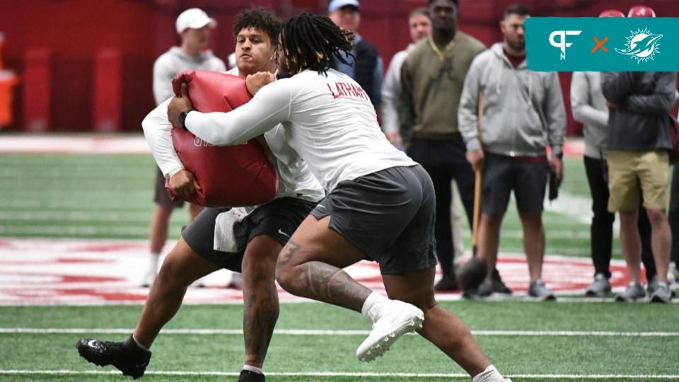 Alabama offensive lineman JC Latham runs a blocking drill against fellow lineman Darrian Dalcourt at the Hank Crisp Indoor Practice Facility during the University of Alabama’s Pro Day.