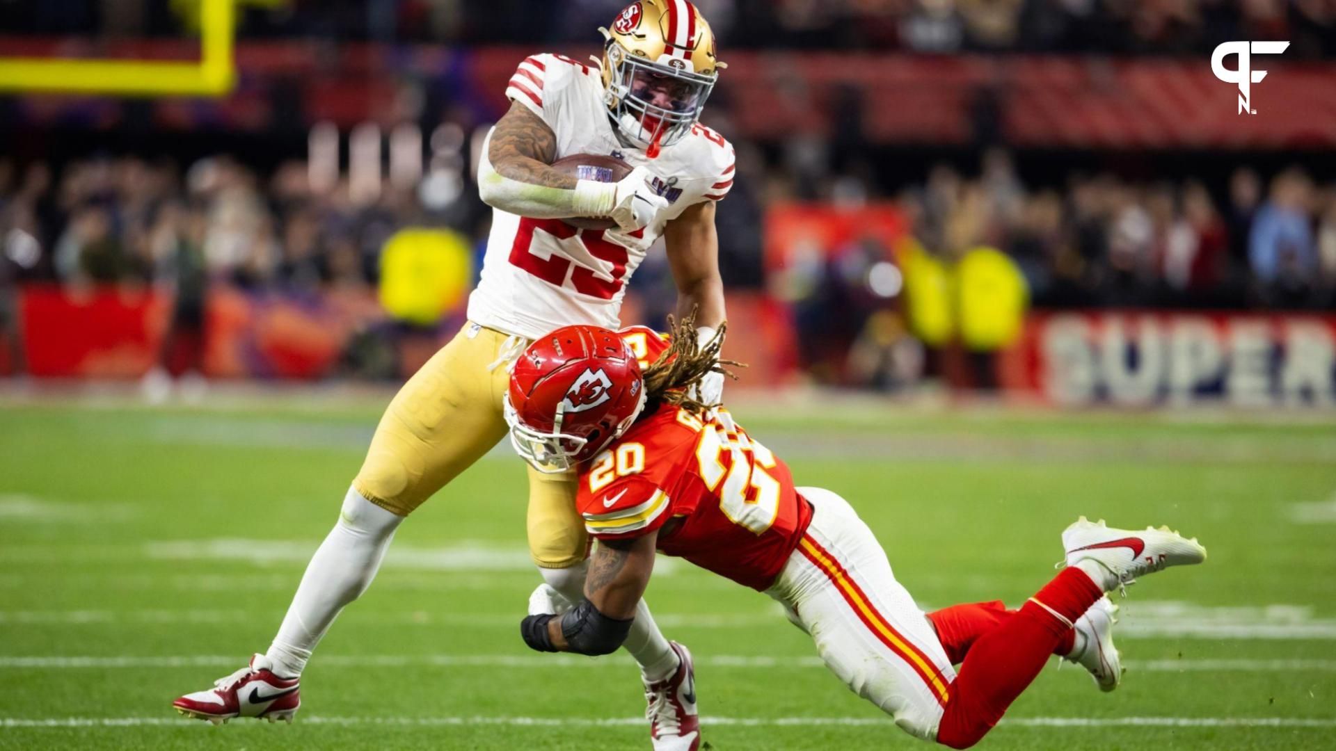 San Francisco 49ers RB Elijah Mitchell (25) is tackled by Kansas City Chiefs S Justin Reid (20) in Super Bowl LVIII.