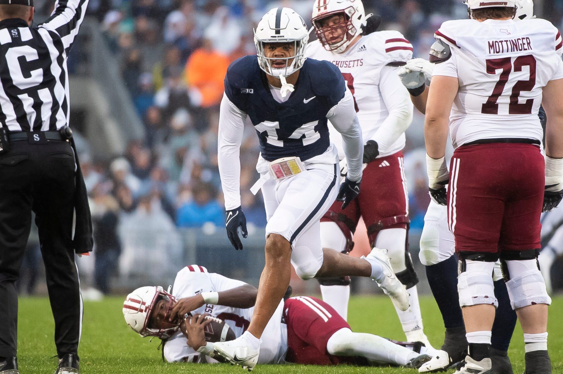 Penn State defensive end Chop Robinson (44) reacts after sacking Massachusetts quarterback Taisun Phommachanh in the first half of a NCAA football game Saturday, Oct. 14, 2023, in State College, Pa.