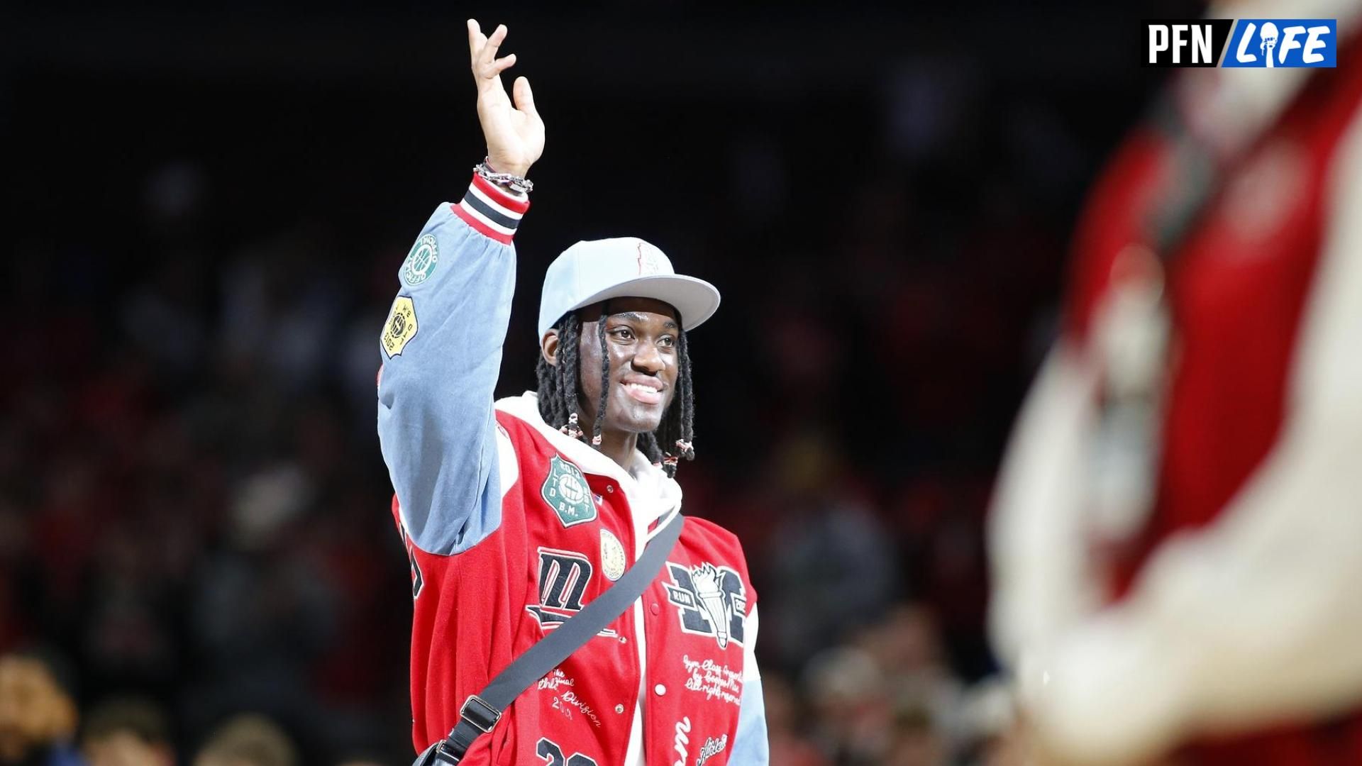 Ohio State Buckeyes wide receiver Marvin Harrison Jr. is honored at center court during the first half of the game between the Ohio State Buckeyes and the Penn State Nittany Lions at Value City Arena.