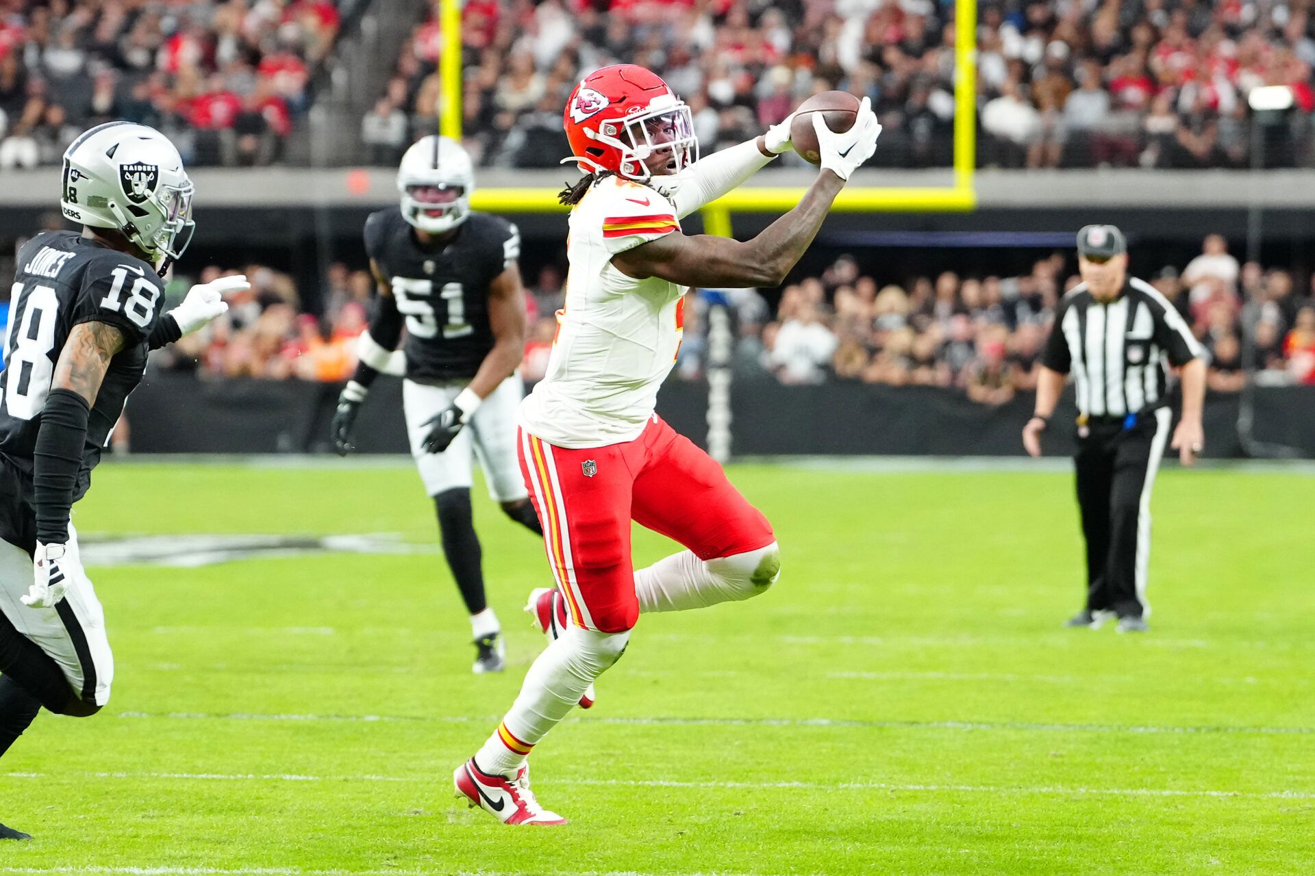 Kansas City Chiefs wide receiver Rashee Rice (4) makes a reception against the Las Vegas Raiders during the second quarter at Allegiant Stadium.