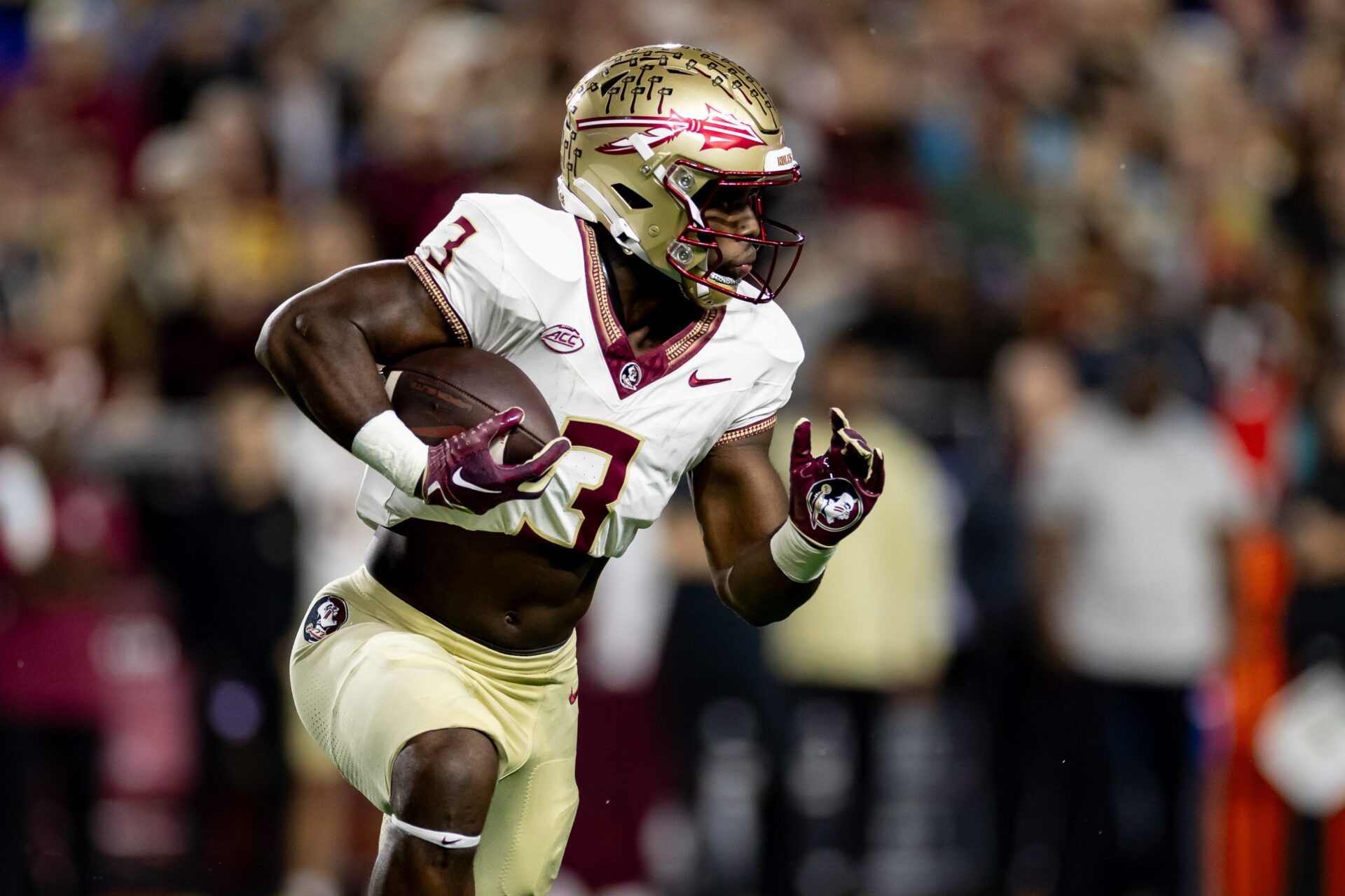 Florida State Seminoles running back Trey Benson (3) rushes with the ball during the first half against the Florida Gators at Steve Spurrier Field at Ben Hill Griffin Stadium in Gainesville, FL on Saturday, November 25, 2023.