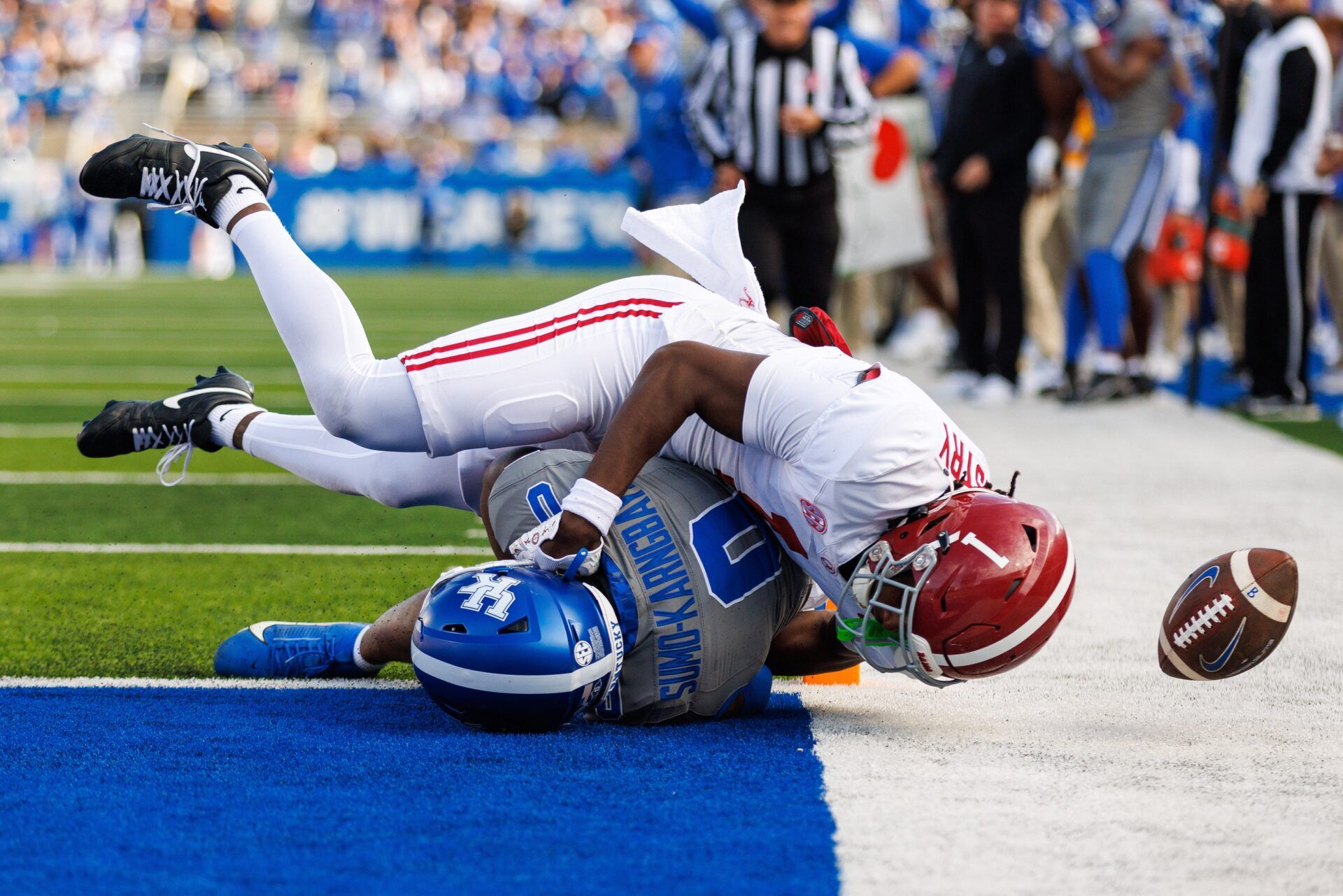 Alabama Crimson Tide defensive back Kool-Aid McKinstry (1) tackles Kentucky Wildcats running back Demie Sumo-Karngbaye (0) during the third quarter at Kroger Field.